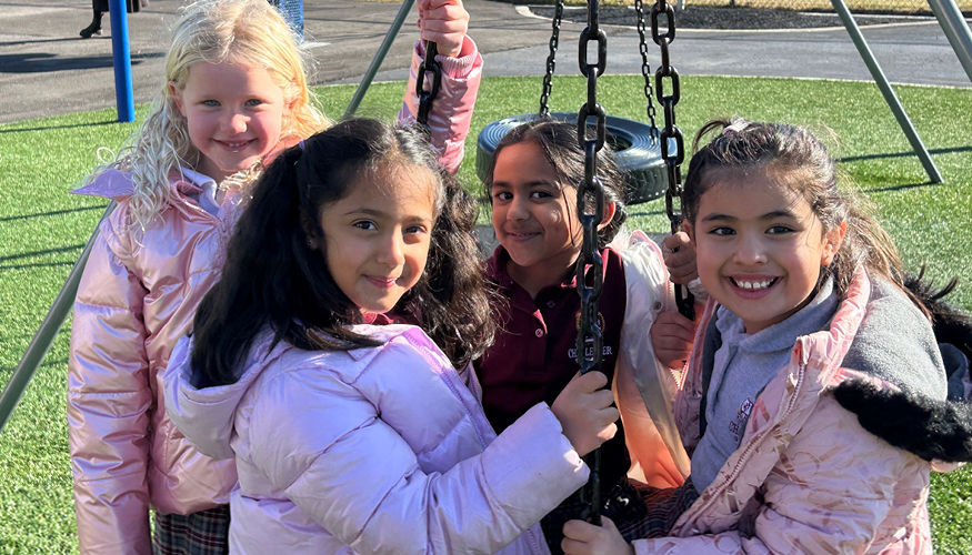 Four Challenger students wearing winter clothing