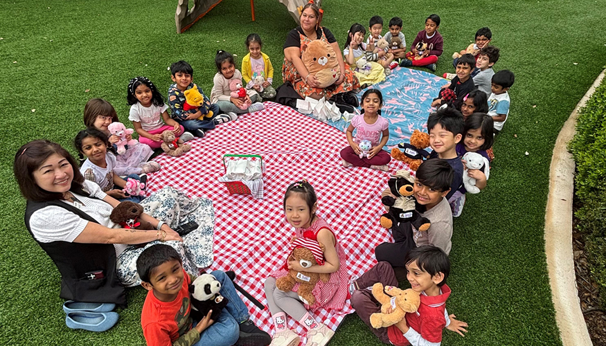 Challenger students enjoying Teddy Bear Picnic