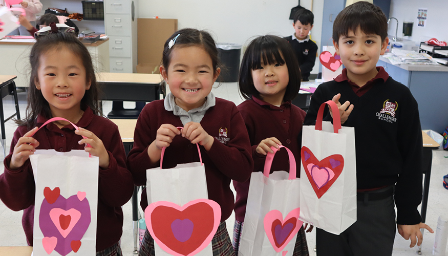Smiling Challenger students enjoying Valentine’s Day celebrations