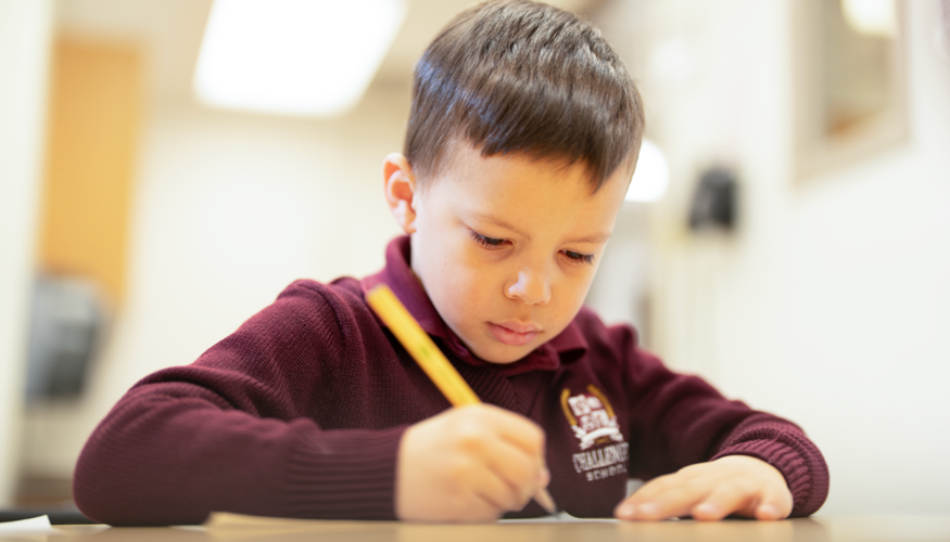 Challenger preschool student practicing penmanship skills