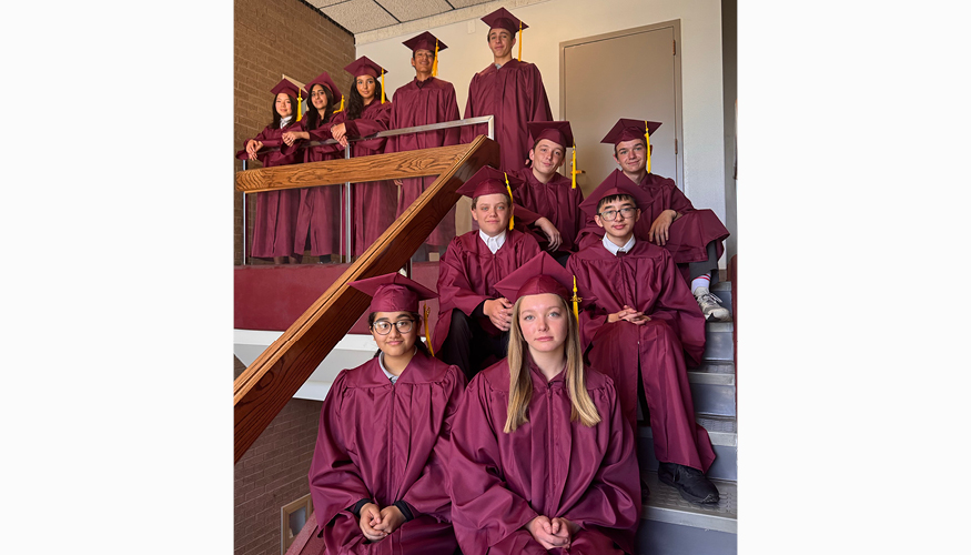 Challenger graduates wearing their cap and gown